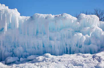 Wall Mural - Giant wall of snow and ice on a beautiful winter day near Minneapolis Minnesota USA