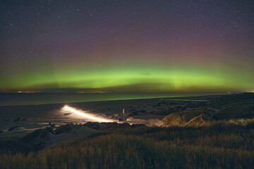 Wall Mural - Aurora Borealis over the beach at danish Coast. High quality photo