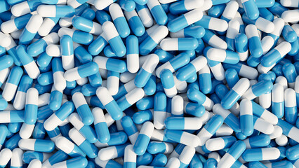 Pile of pills background, pill capsules in white and blue. drug or vitamin capsules.