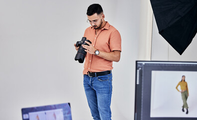 Aufkleber - Serious, photographer and man on camera in studio for shoot, magazine project or online content. Backstage or male thinking for digital profession, fashion web design or creative internet catalog