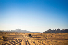 A Truck Driving Off Road Through The Wadi Rum Desert