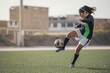 © Cavan Images - Latin female soccer player kicking ball