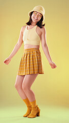 Wall Mural - Dancing, Asian woman and retro fashion isolated on a yellow background in a studio. Happy and stylish girl model with dance for freedom, motivation and carefree mindset with creative or crazy energy