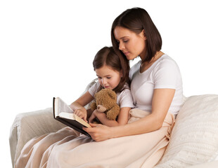 Young mother and child girl reading a book in bed before going to sleep