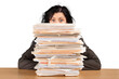 © BillionPhotos.com - Businesswoman sitting at the table with many papers on background