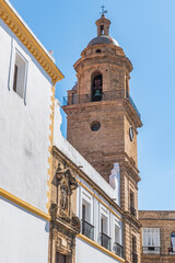 Sticker - Bell tower and perspective of Santo Domingo convent with pediment and religious statue above the entrance door, Cádiz SPAIN