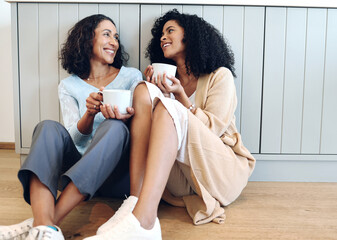 Poster - Love, coffee and mother in conversation with her daughter on the floor in the kitchen of the family home. Happy, smile and adult female child talking to her mature mom while drinking a cup of tea.