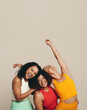 © Jacob Lund - Celebrating sport and fitness: Three young women standing in a studio wearing fitness clothing