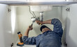 © Lumeez/peopleimages.com - Plumber, man and handyman with plumbing, home renovation and manual labour with tools. Construction, DIY skills and professional, fixing pipe in industry and male with trade, repairs and maintenance