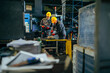 © bernardbodo - Industry workers manufacturing metal parts.