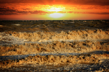 Wall Mural - sunset over stormy sea