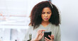 © Siphosethu F/peopleimages.com - Phone, black woman and frustrated frown of a person on digital communication reading fake news. Annoyed woman on web, internet and social media scroll confused about digital media reading in a office