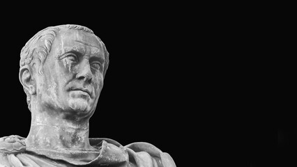 Wall Mural - Julius Caesar, the most famous general and leader of Ancient Rome. An old bronze statue replica along Imperial Fora Rome in Rome (Black and White with copy space)