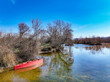 Karacabey Longoz Forests. View of red small boat on Longoz forest lake in winter season. Karacabey, Bursa,Turkey