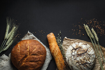 Composition healthy homemade bread black background, top view