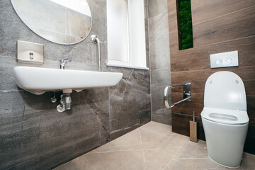 Interior of modern toilet with handrail