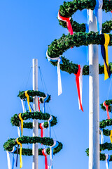 Canvas Print - typical bavarian maypole with wreath