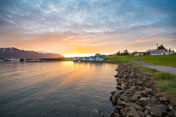 Wall Mural - Summer sunset in at the coast of the village on island of Hrisey in Iceland