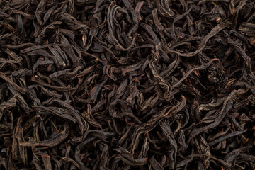 Close up Chinese oolong leaf tea. Dried tea leaves, top view. Macro