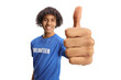 © Ljupco Smokovski - Young african american male volunteer showing thumbs up