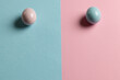 Image of pink and blue easter eggs and copy space on pink and blue background