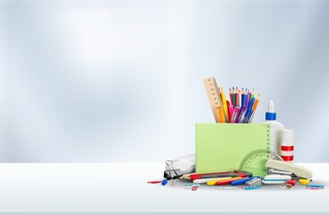 Sticker - Student desk  with colorful supplies. School concept