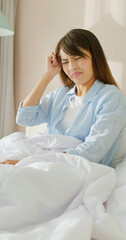 Wall Mural - woman has headache on bed