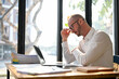 © bongkarn - Focused Caucasian businessman pensively thinking about his project, making serious decisions