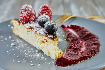 Canvas Print - Cheesecake without dough with red fruit sauce