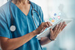 Doctor, hands and tablet in healthcare research, mobile app or software icons for innovation or communication at clinic. Hand of medical expert, nurse or specialist on touchscreen for medicare search