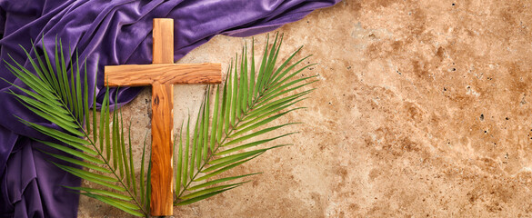 lent season, holy week and good friday concept. palm leave and cross on stone background