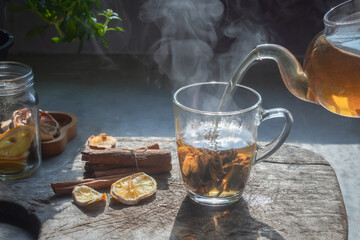 Wall Mural - Tea hot drink on old background in composition on the table