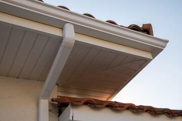 Wall Mural - Gutter aluminum on Roof Corner of the new house with gutter roof and wall