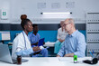© DC Studio - Healthcare clinic specialist taking notes about sick elderly patient health condition while recommending advanced consultation and examination. Hospital practitioner writing on clipboard illness