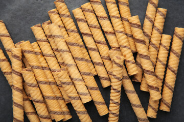 Wall Mural - Close-up of striped wafer rolls. Background or texture