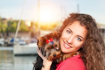 Poster - Young happy woman hugging cute domestic dog