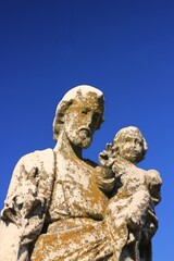 Wall Mural - Saint Joseph holding the baby Jesus.