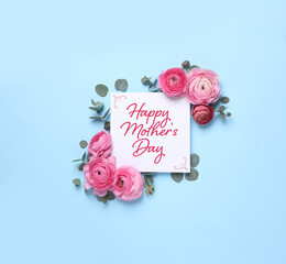 Wall Mural - Happy Mother's Day greeting card and beautiful flowers on light blue background, flat lay