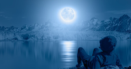 Wall Mural - knud rasmussen glacier near kulusuk - greenland, east greenland - night sky with blue moon in the cl