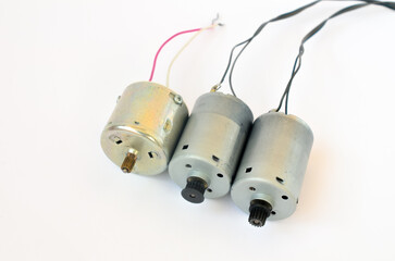 Small electric motors from various equipment on a white background