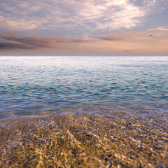 Wall Mural - Tranquil natural marine landscape.  Clear water and beautiful sunset