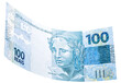 banknote of one hundred reais from brazil falling on isolated white background
