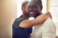 Happy Homosexual Man Embracing With Unrecognizable Partner