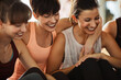 © Flamingo Images - Laughing friends sitting together after an exercise class