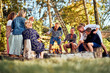 © Flamingo Images - Family toasting marshmallows around a fire