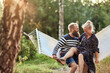 © Flamingo Images - Couple laughing on a hammock