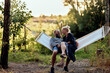 © Flamingo Images - Couple laughing together on a hammock