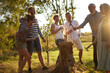 © Flamingo Images - Laughing family playing Stump outdoors