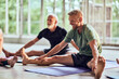 © Flamingo Images - Man stretching in gym. Doing yoga in yoga studio