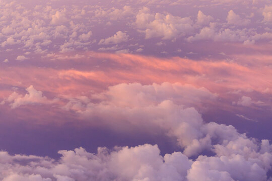 looking down on pink clouds at sunrise from high elevation